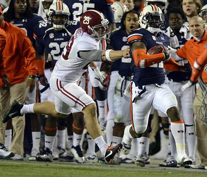 Alabama wide receiver Caleb Sims (29) grabs for Auburn cornerback Chris Davis (11) during the Iron Bowl at Jordan-Hare Stadium on Saturday, Nov. 30, 2013. Ironbowl2013no2